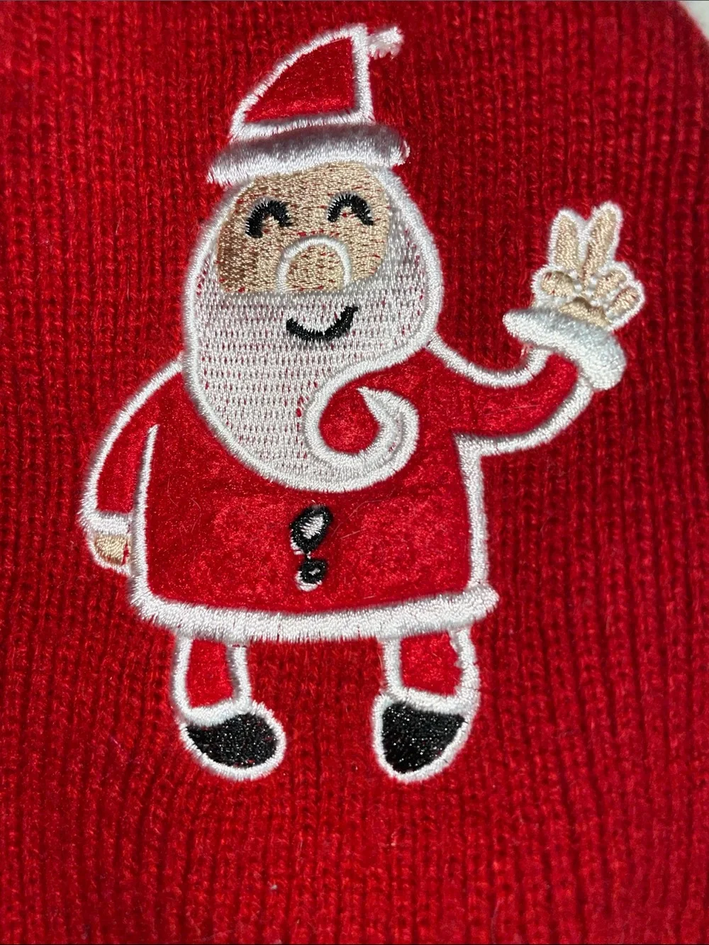 Two dog outfits, size XS…one Christmas sweater & one 4th of July dress